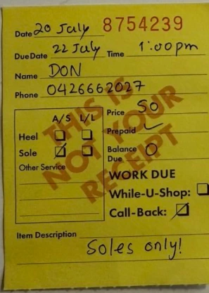 An upright handwritten yellow service docket used as demonstration media